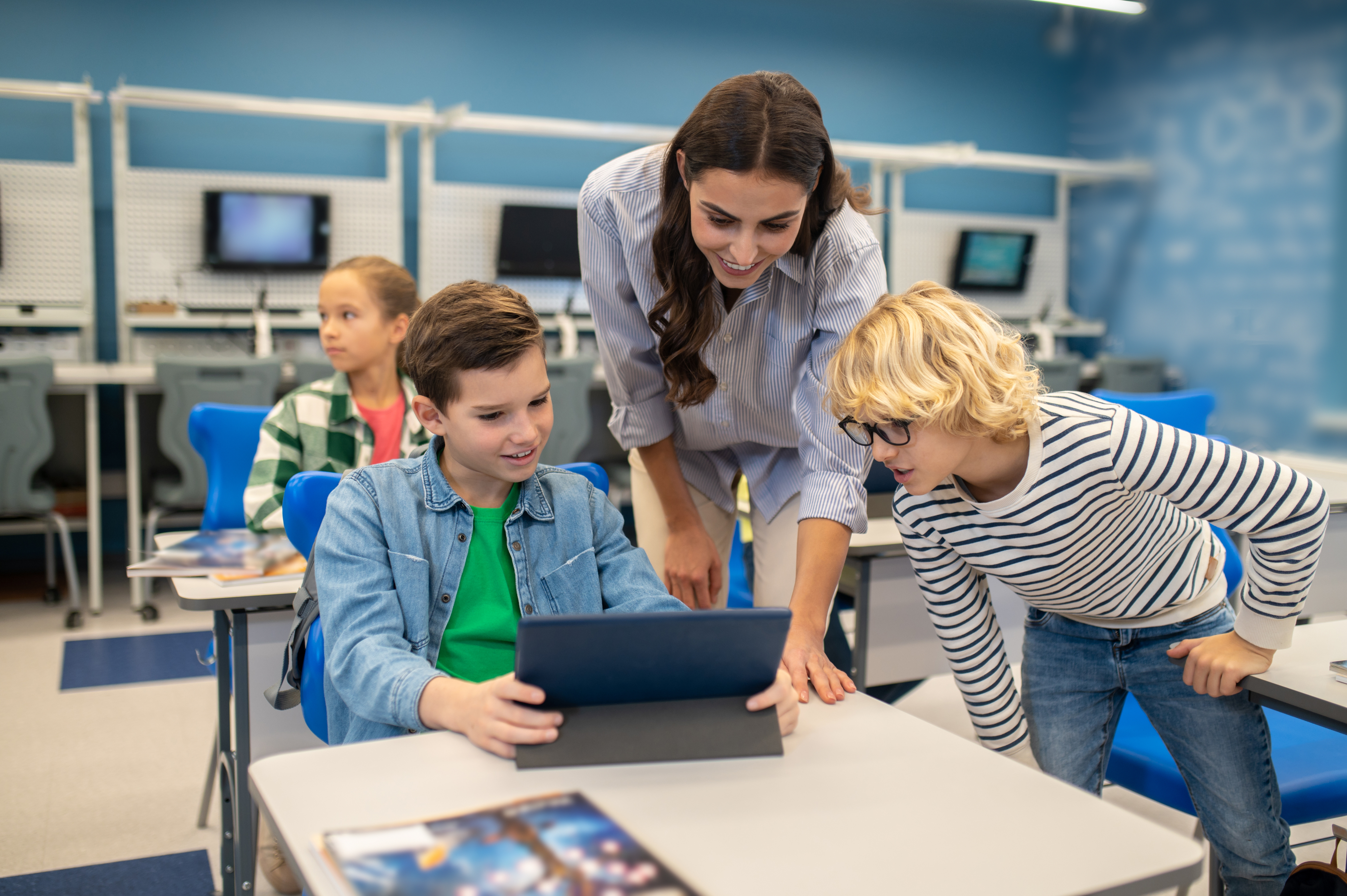 Teacher helping kids
